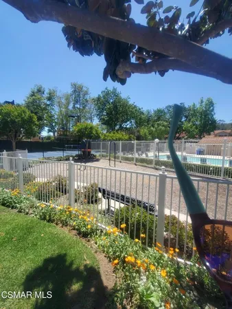 a garden view with a lake