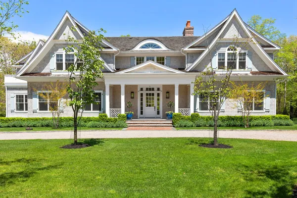 front view of a house with a yard