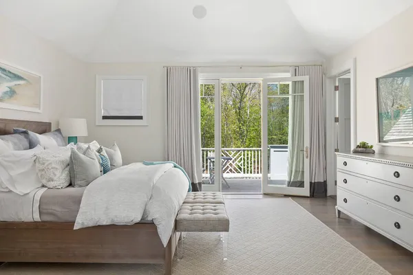 a bedroom with furniture and a window