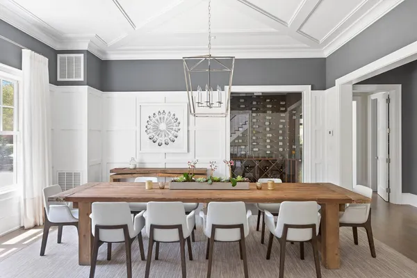 a dining room with furniture and window