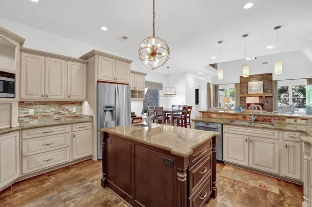 a kitchen with sink stove and cabinets