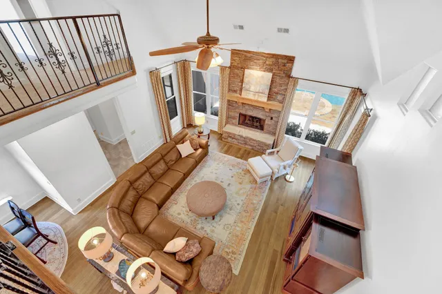 a view of living room with furniture and a fireplace