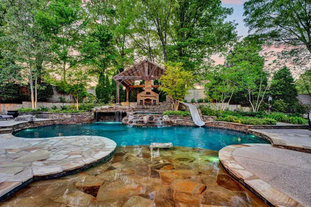 a view of a swimming pool and lounge chair