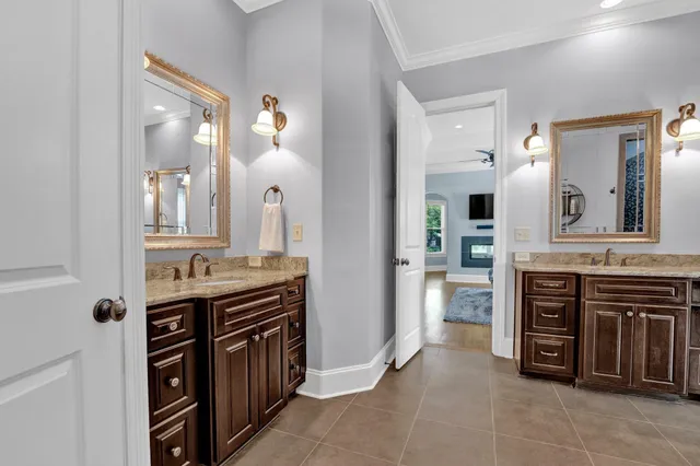 a view of kitchen with stainless steel appliances cabinets and stove top oven