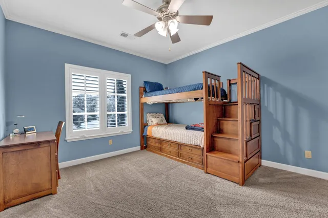 a bedroom with furniture and window