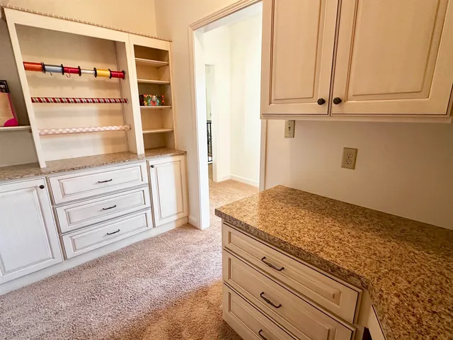 a view of dresser and window