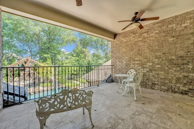 a view of a chair and table in the balcony