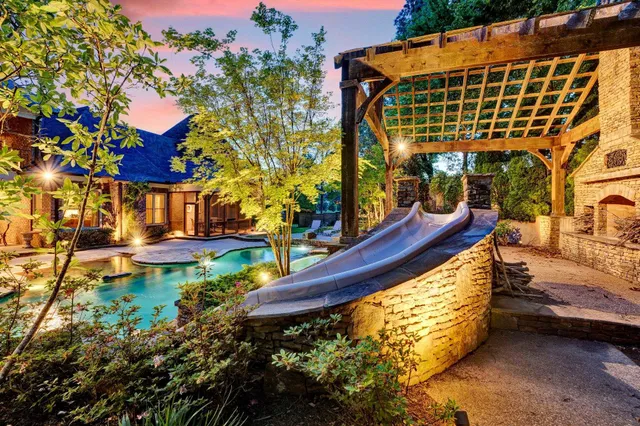 a view of swimming pool with a patio