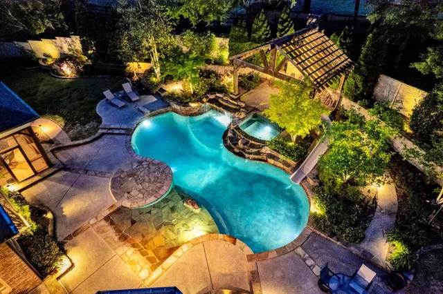 a backyard of a house with outdoor seating