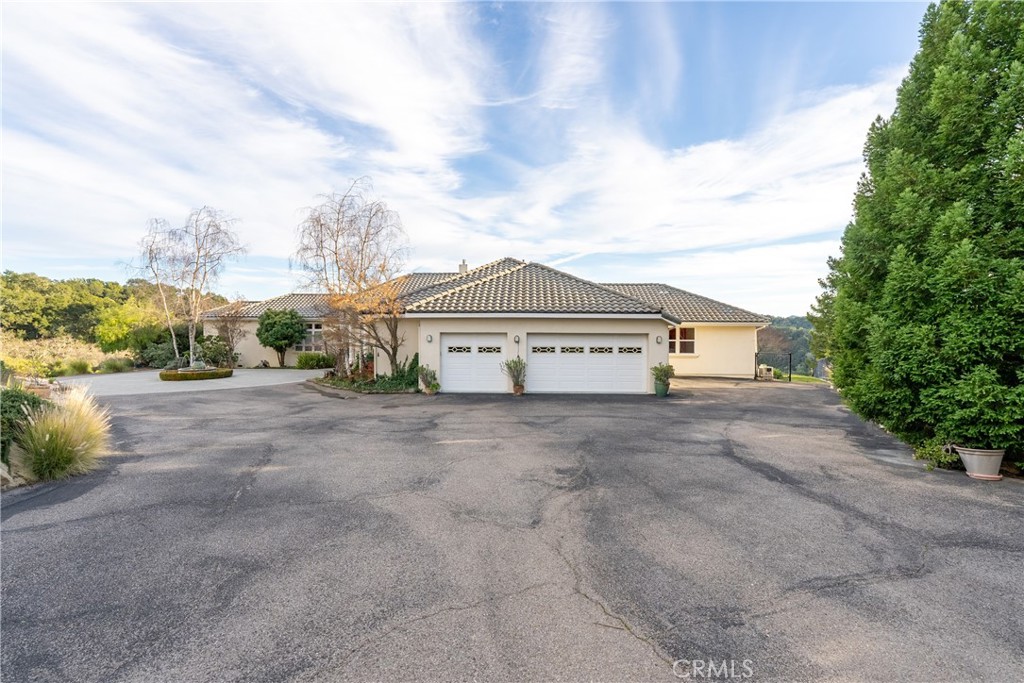 4342 Shadow Canyon Road Templeton, CA 93465 - Photo 18 of 74 a view of a house with a yard and large trees