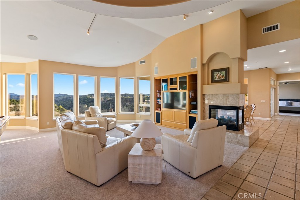 4342 Shadow Canyon Road Templeton, CA 93465 - Photo 22 of 74 a living room with furniture fireplace and large windows
