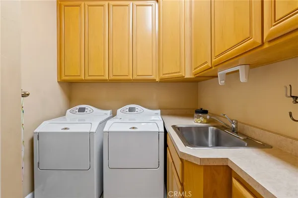 a view of kitchen with sink and microwave