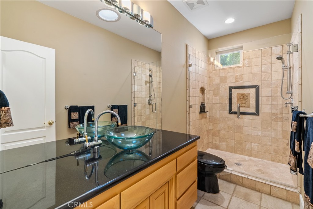 4342 Shadow Canyon Road Templeton, CA 93465 - Photo 41 of 74 a bathroom with a sink a toilet and shower