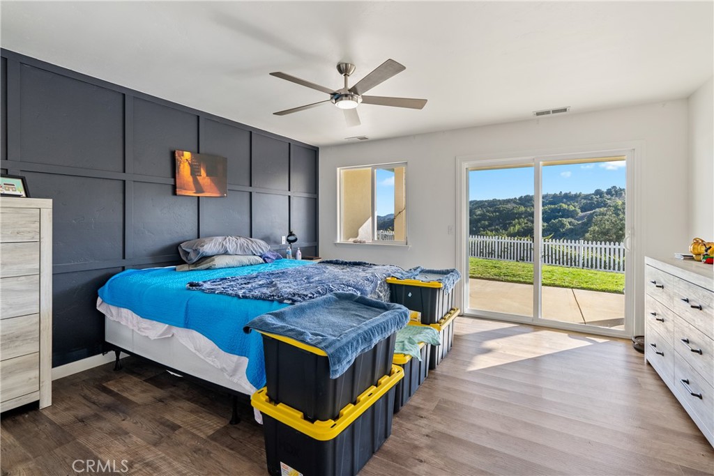 4342 Shadow Canyon Road Templeton, CA 93465 - Photo 61 of 74 a bed room with a bed and a chandelier