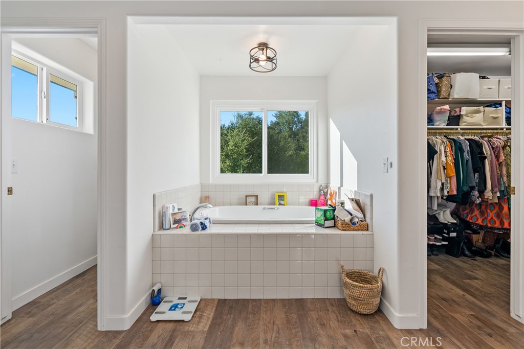 4342 Shadow Canyon Road Templeton, CA 93465 - Photo 62 of 74 a bathroom with a bathtub a sink and a window