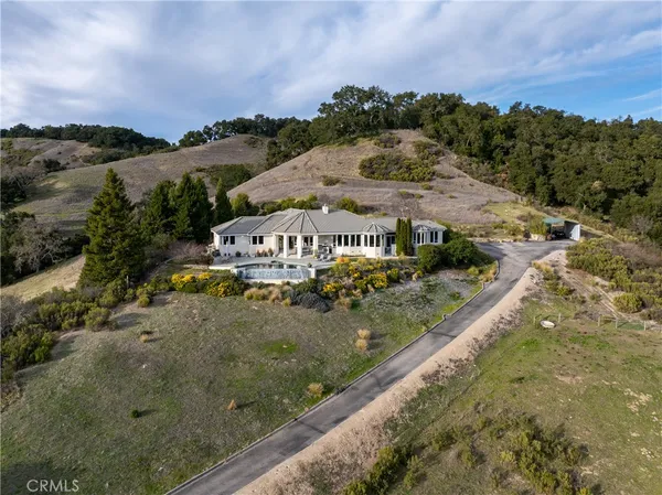 a front view of a house with swimming pool