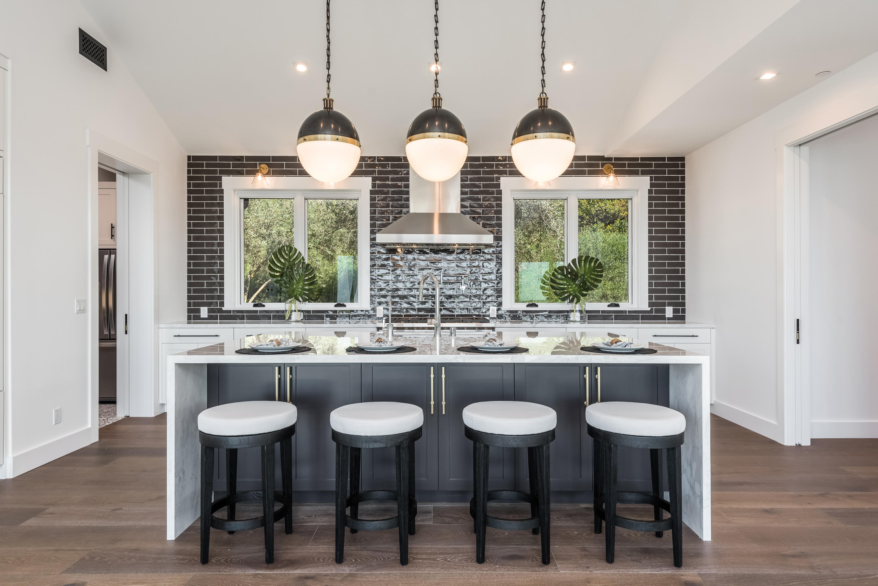 950 Brooktree Road Santa Barbara, CA 93108 - Photo 20 of 37 a kitchen with center island and a wooden floors