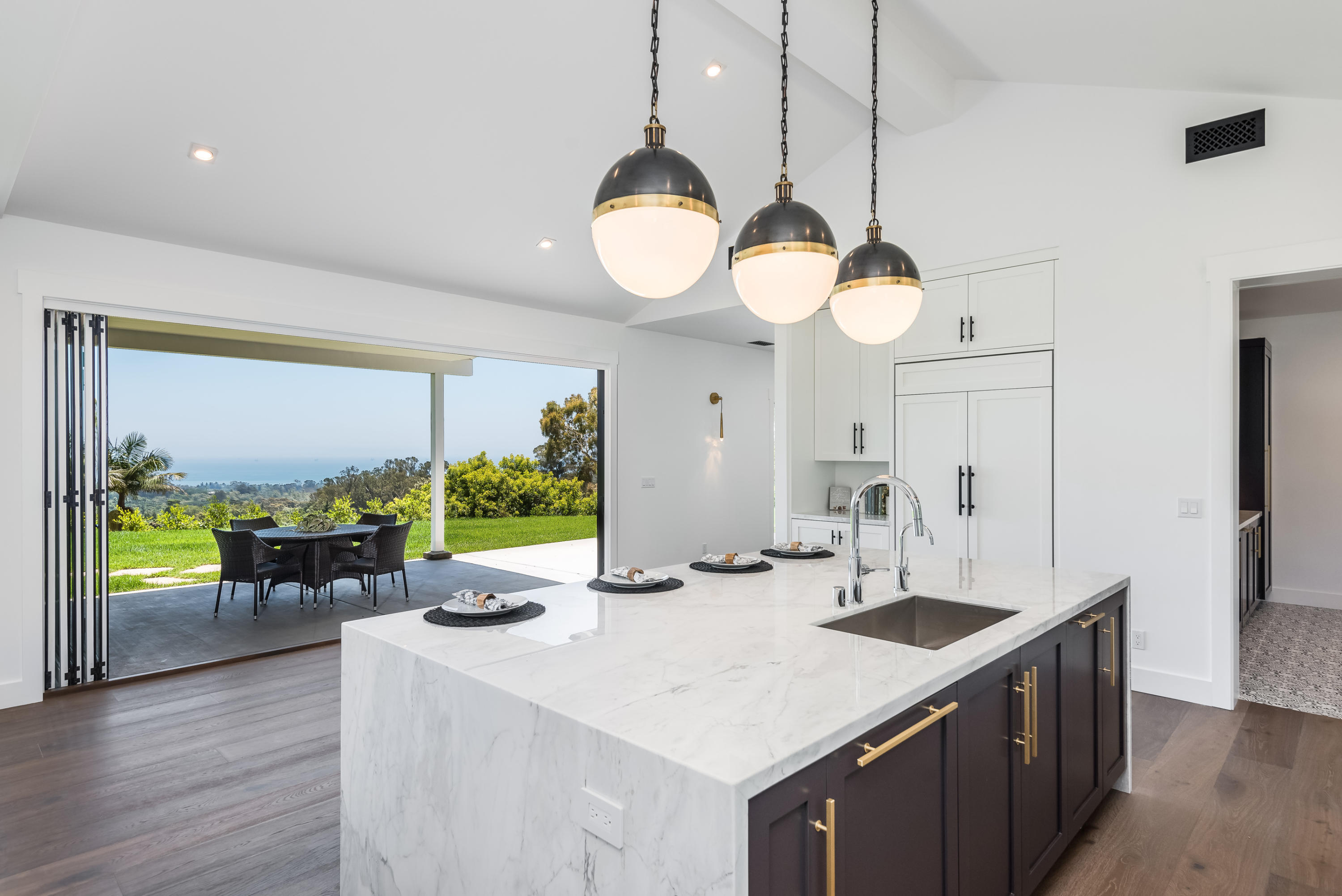 950 Brooktree Road Santa Barbara, CA 93108 - Photo 22 of 37 a kitchen with a table chairs and chandelier