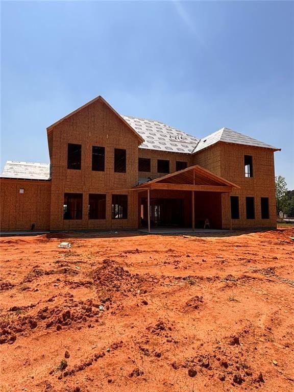 3285 Hall Road Dacula, GA 30019 - Photo 2 of 20 a front view of a house with a yard