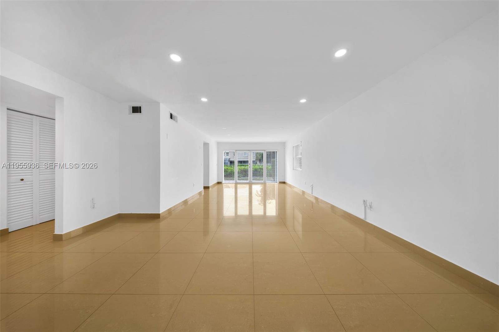 6960 Southwest 54th Street Miami, FL 33155 - Photo 11 of 55 a view of an empty room with wooden floor