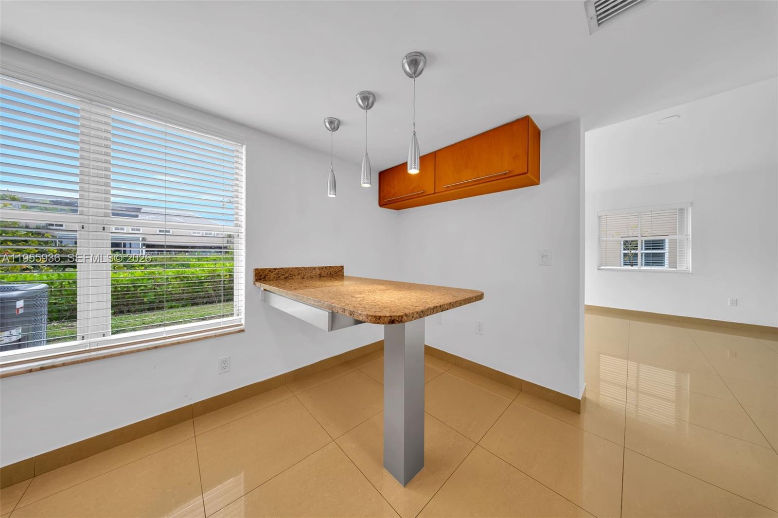 6960 Southwest 54th Street Miami, FL 33155 - Photo 19 of 55 a view of a livingroom with wooden floor and a potted plant