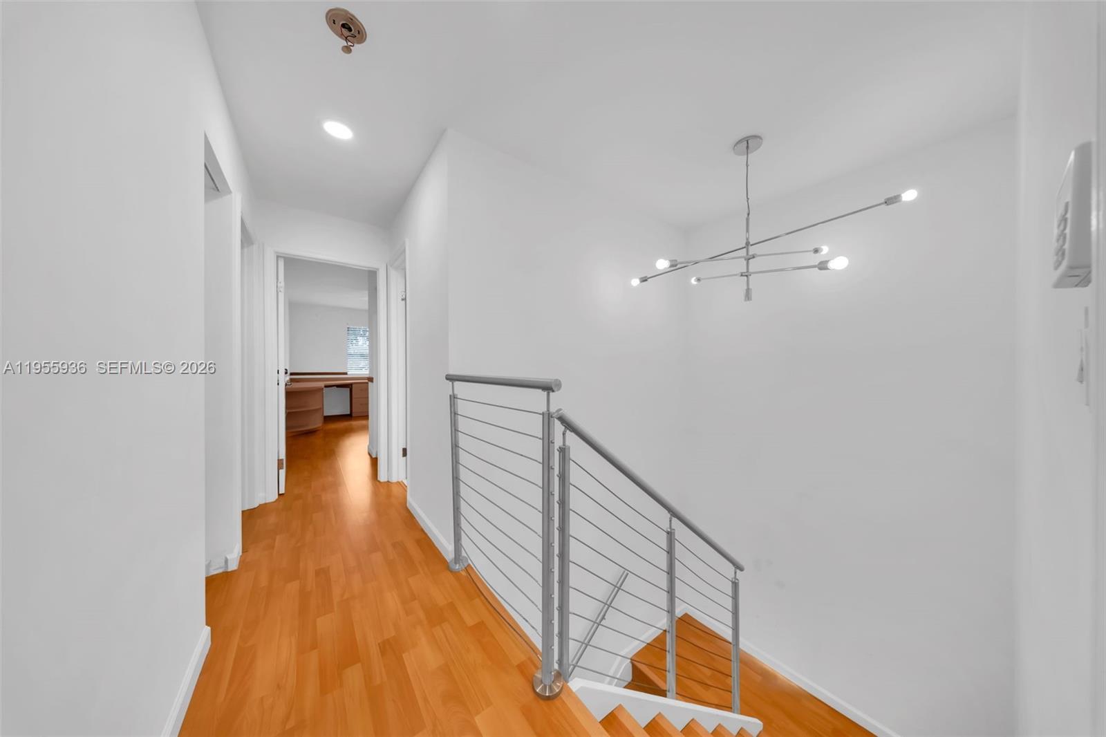 6960 Southwest 54th Street Miami, FL 33155 - Photo 31 of 55 a view of a hallway with wooden floor