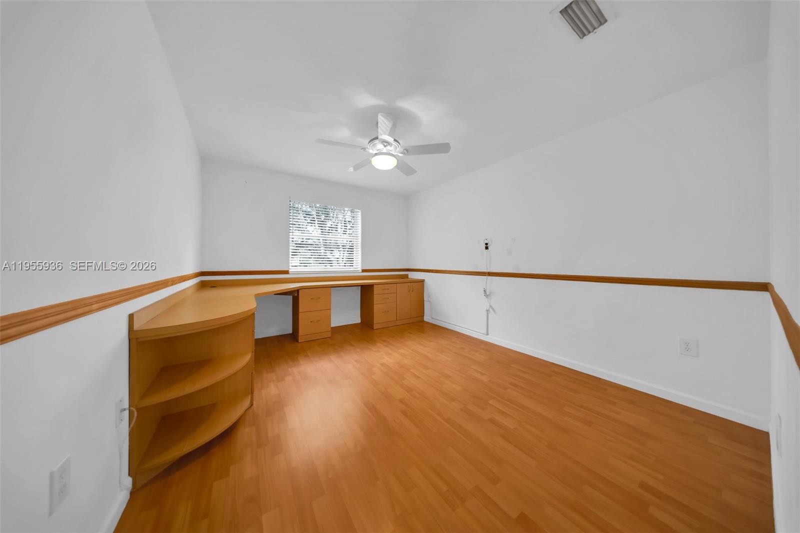 6960 Southwest 54th Street Miami, FL 33155 - Photo 32 of 55 a view of an empty room with a window