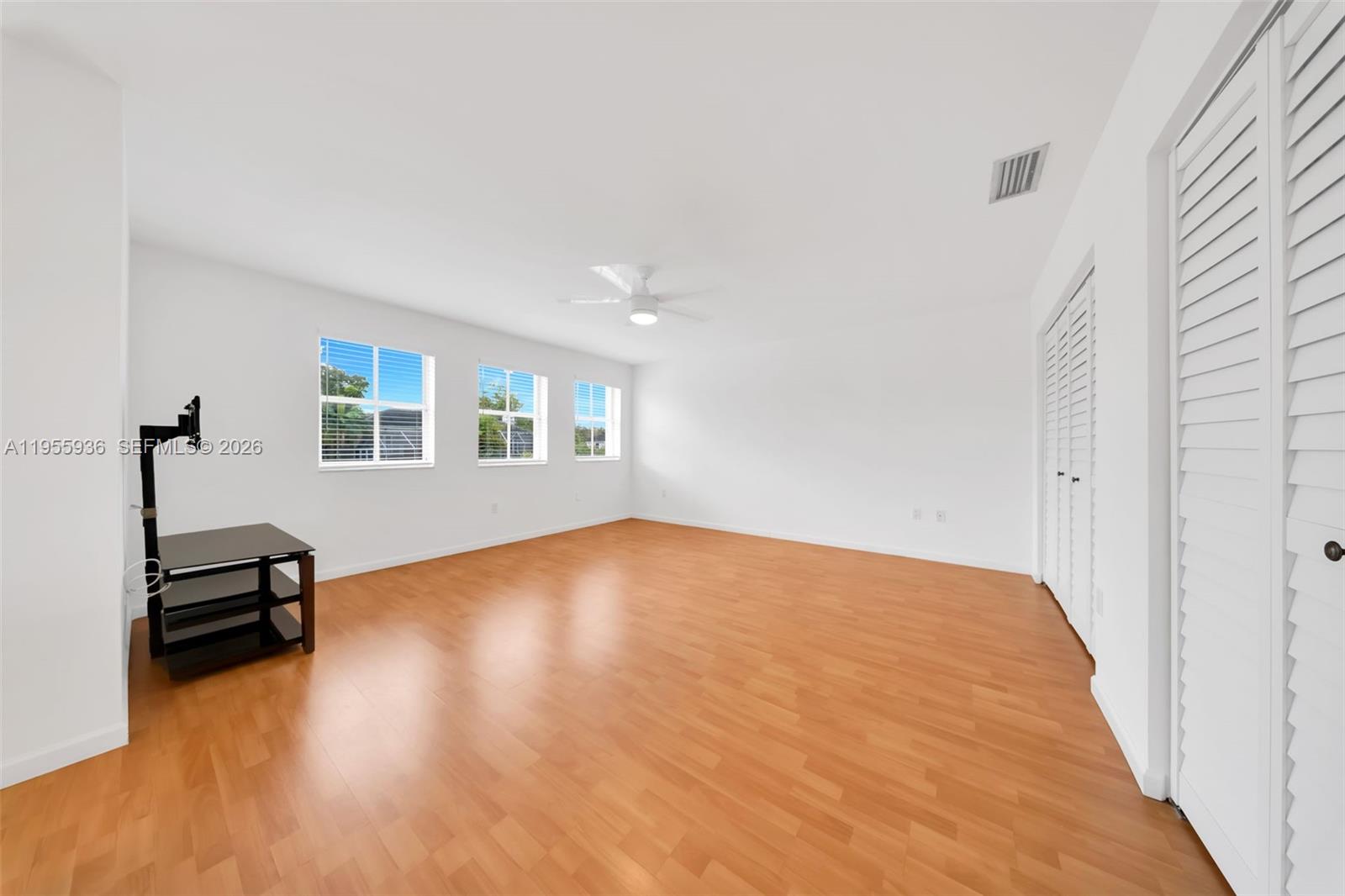 6960 Southwest 54th Street Miami, FL 33155 - Photo 43 of 55 a view of a livingroom with wooden floor and a window