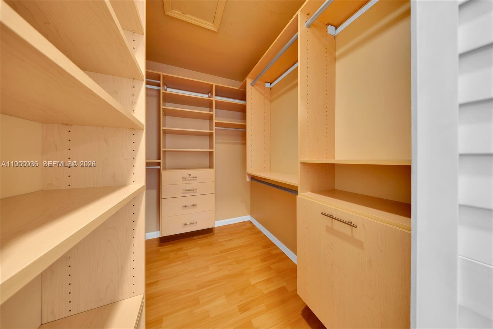 6960 Southwest 54th Street Miami, FL 33155 - Photo 45 of 55 a view of walk in closet with empty racks