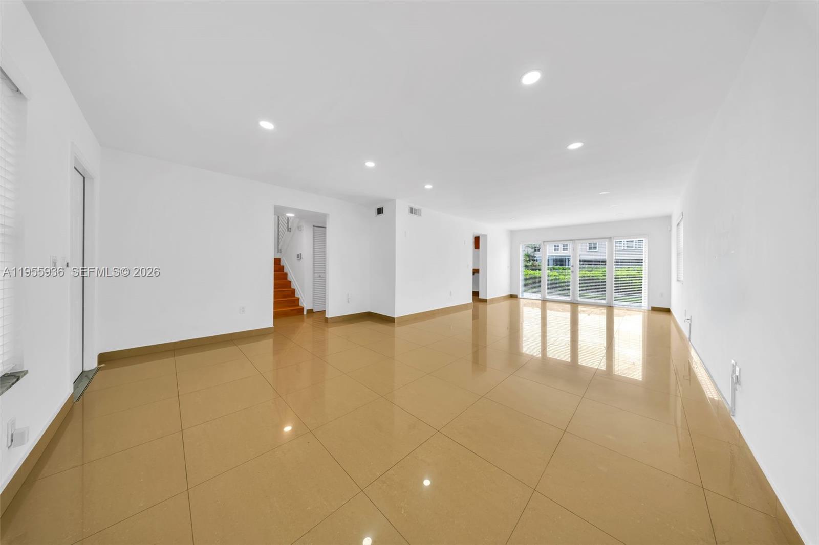 6960 Southwest 54th Street Miami, FL 33155 - Photo 10 of 55 a view of an empty room with glass door