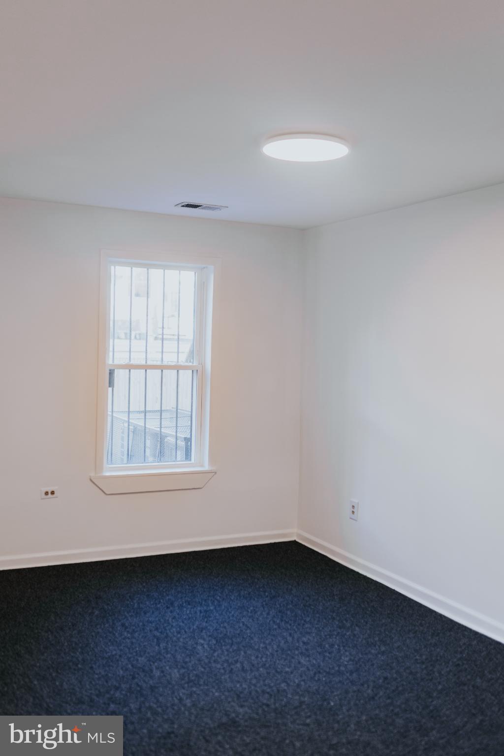 2511 Madison Avenue, Unit 1 Baltimore, MD 21217 - Photo 14 of 23 an empty room with a window