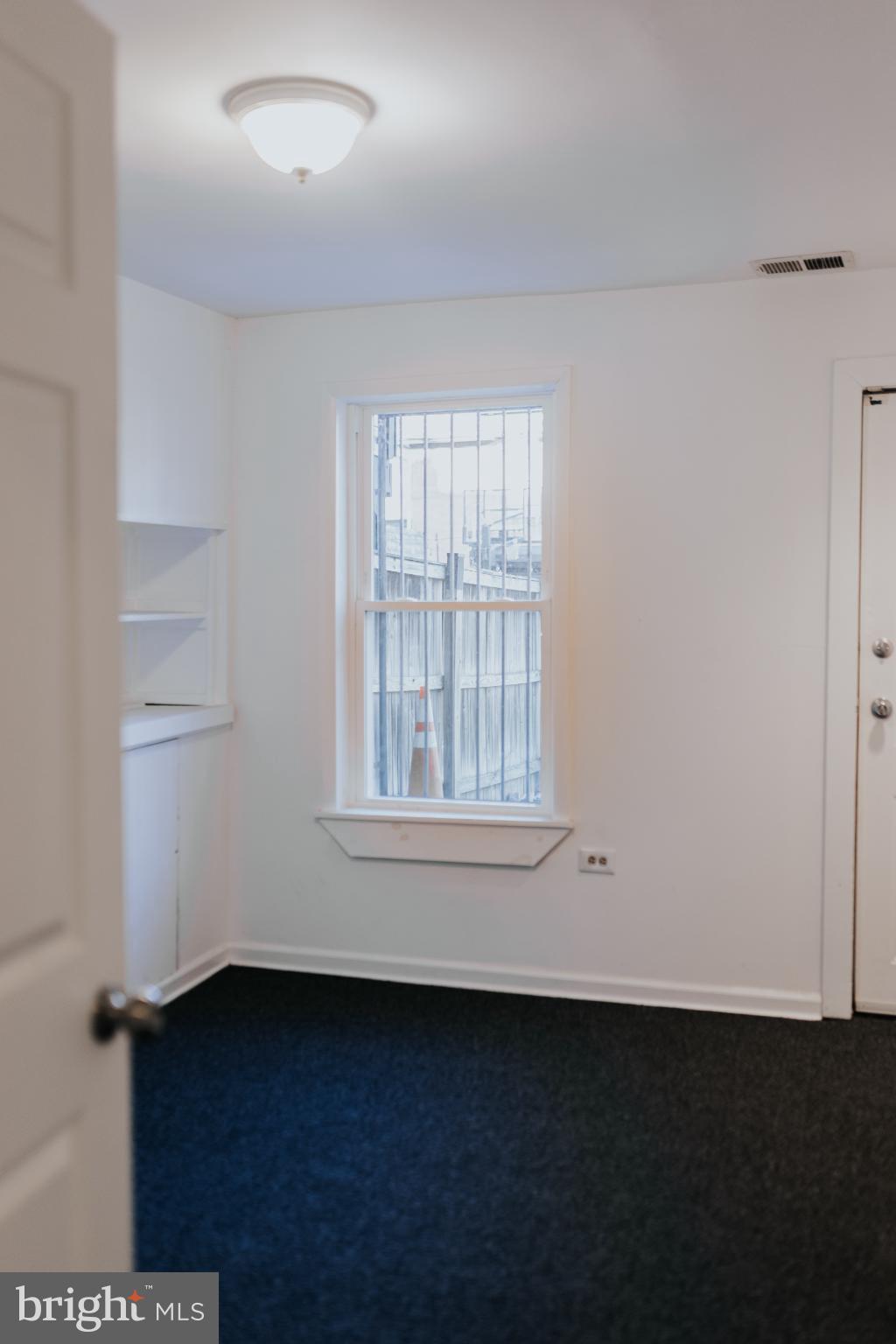 2511 Madison Avenue, Unit 1 Baltimore, MD 21217 - Photo 17 of 23 an empty room with a window