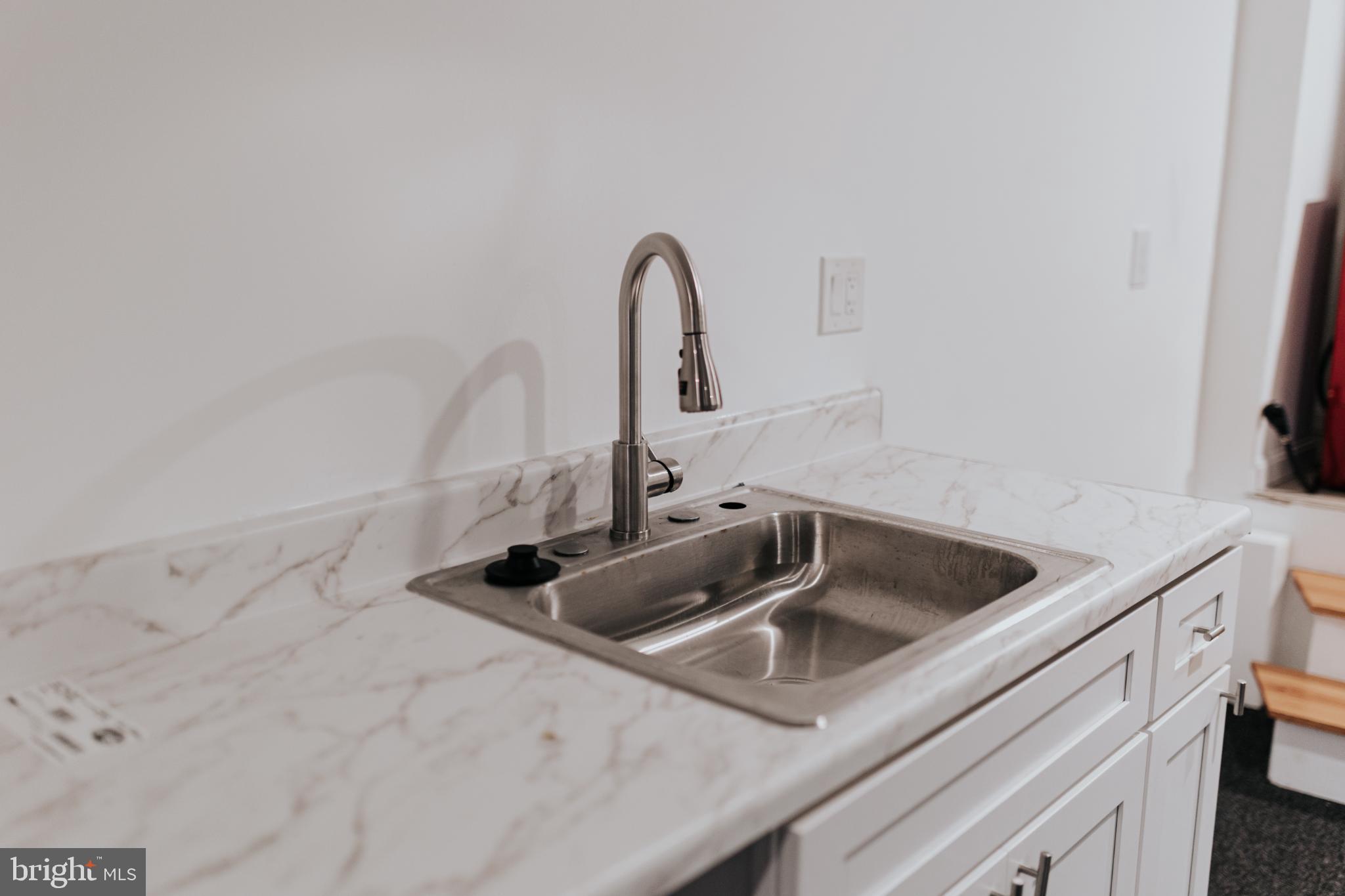 2511 Madison Avenue, Unit 1 Baltimore, MD 21217 - Photo 20 of 23 a close view of a sink and a vanity