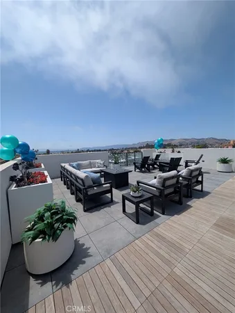 a view of a terrace with furniture and a potted plant