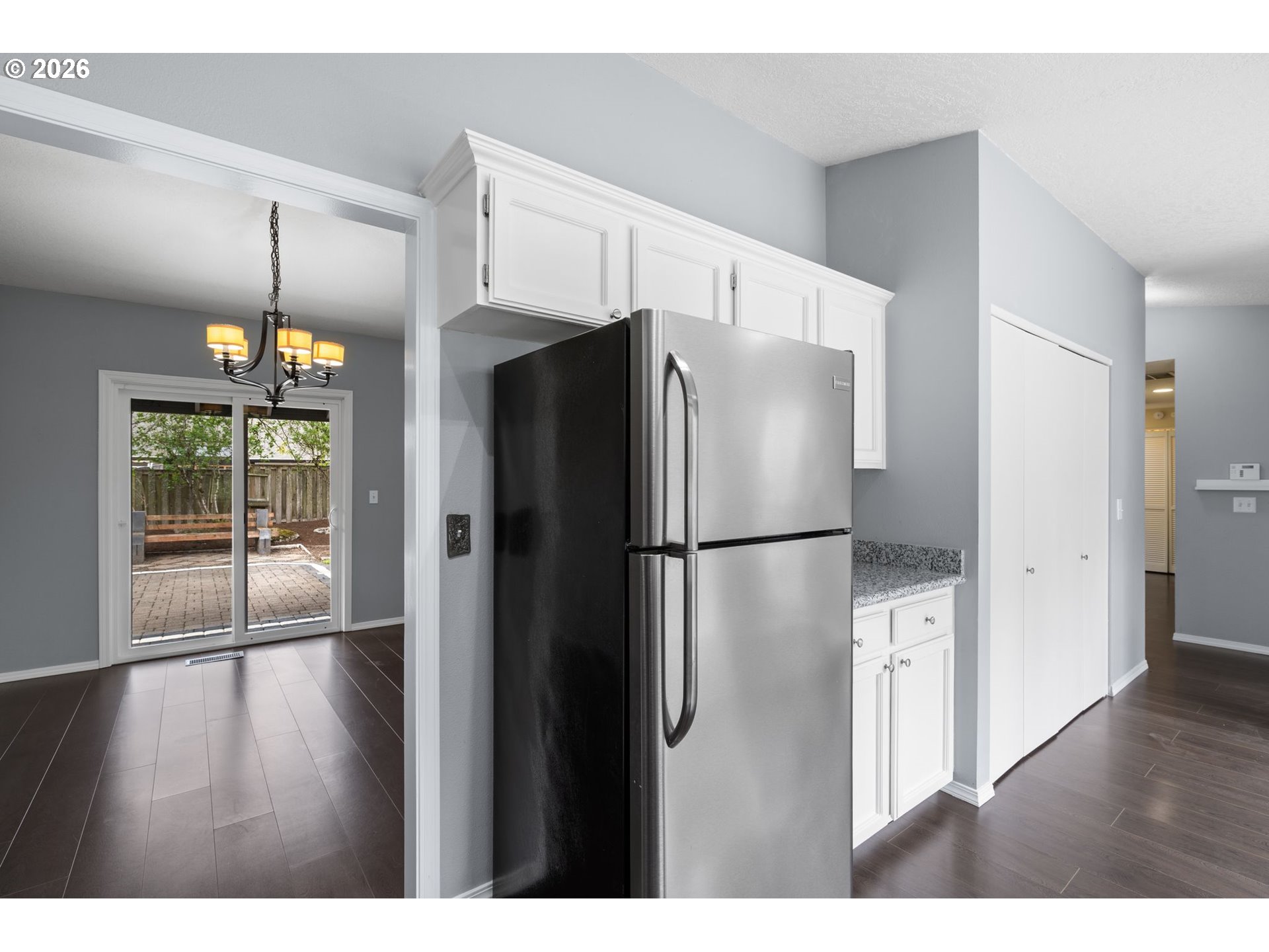 895 Southwest 166th Avenue Beaverton, OR 97006 - Photo 12 of 36 a kitchen with stainless steel appliances a refrigerator and wooden floor
