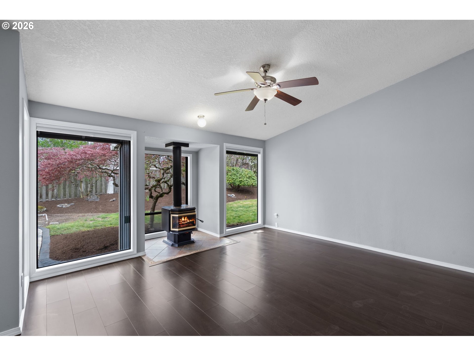 895 Southwest 166th Avenue Beaverton, OR 97006 - Photo 15 of 36 a view of an empty room with window wooden floor