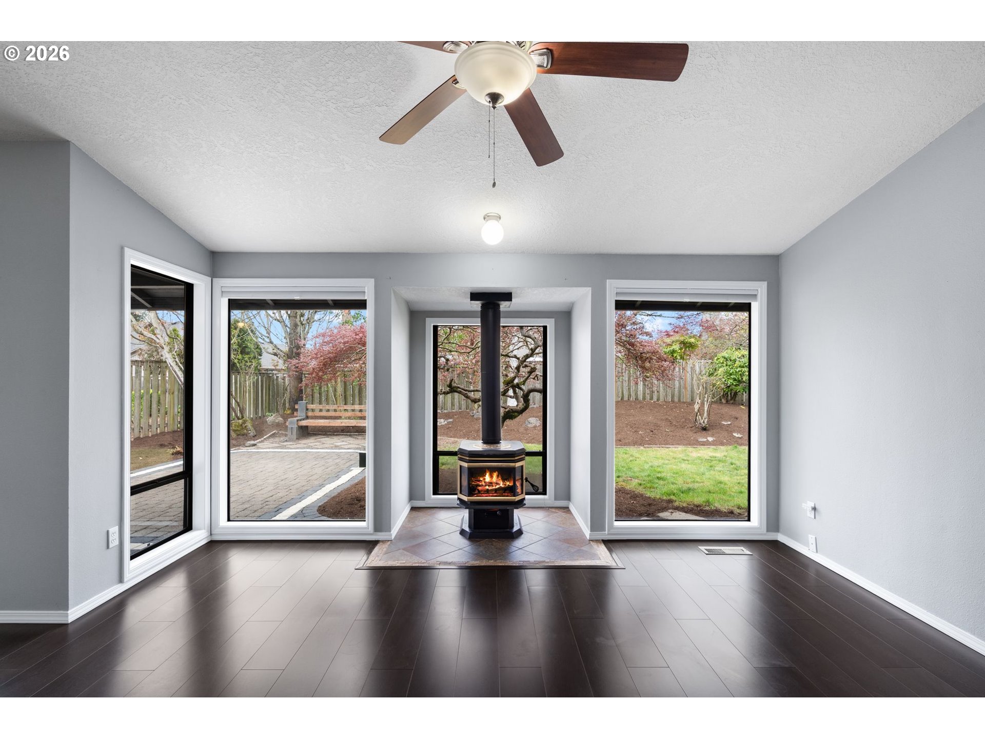 895 Southwest 166th Avenue Beaverton, OR 97006 - Photo 16 of 36 a view of an empty room with window a ceiling fan and wooden floor