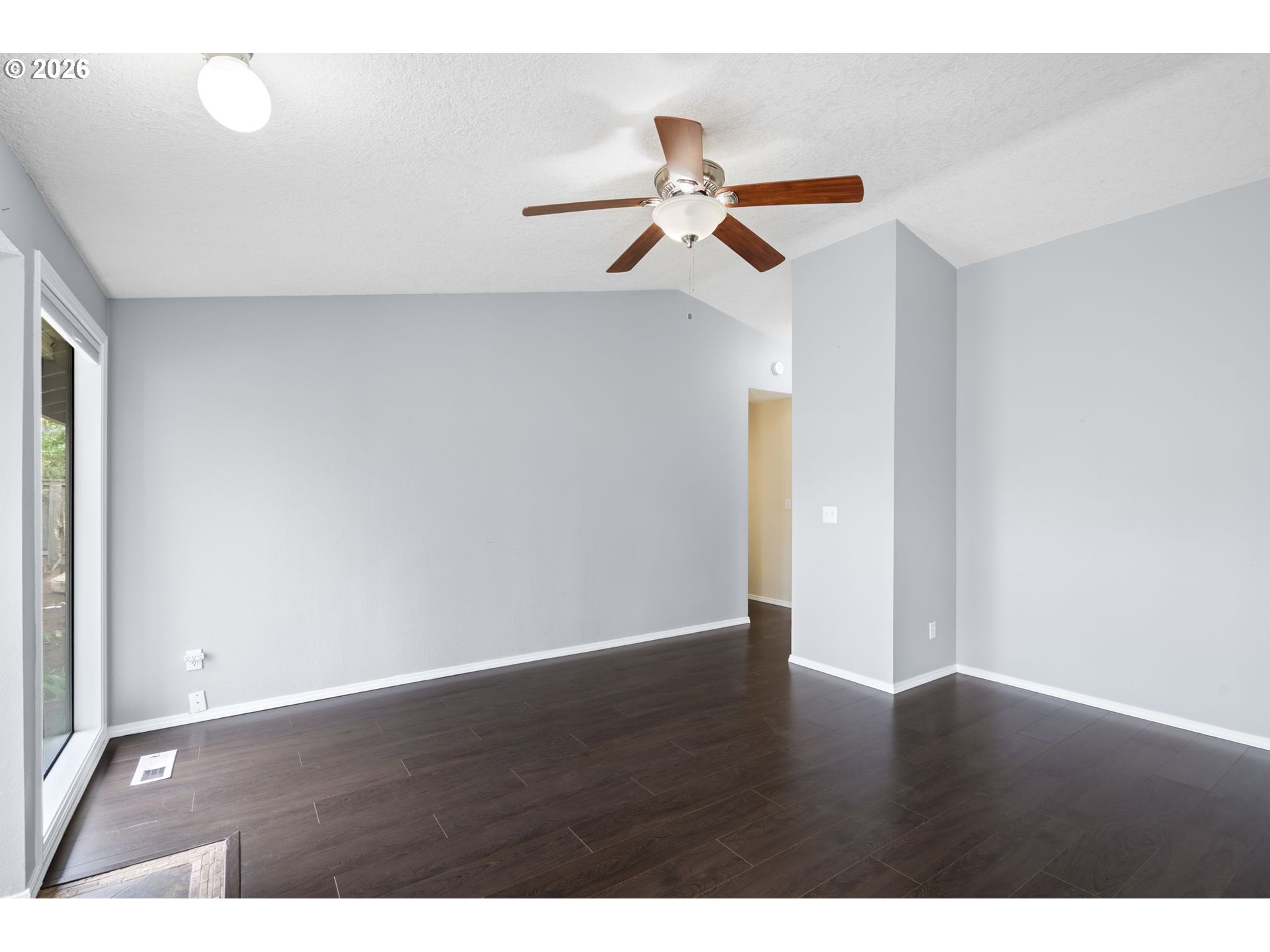 895 Southwest 166th Avenue Beaverton, OR 97006 - Photo 18 of 36 a view of a room with wooden floor and white walls