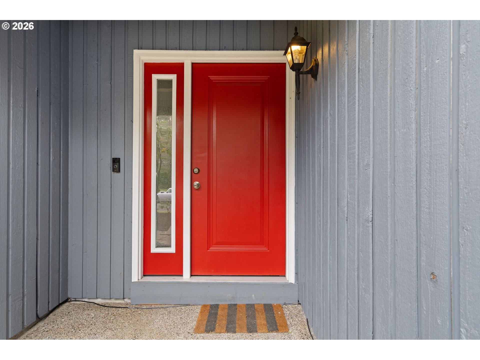 895 Southwest 166th Avenue Beaverton, OR 97006 - Photo 2 of 36 a view of a living room with a red door and wooden door