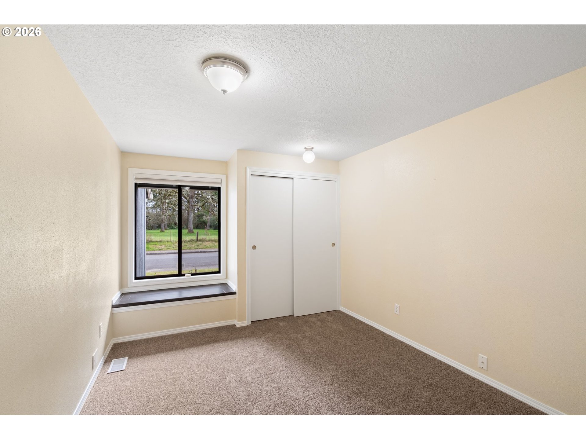 895 Southwest 166th Avenue Beaverton, OR 97006 - Photo 21 of 36 a view of an empty room with a window