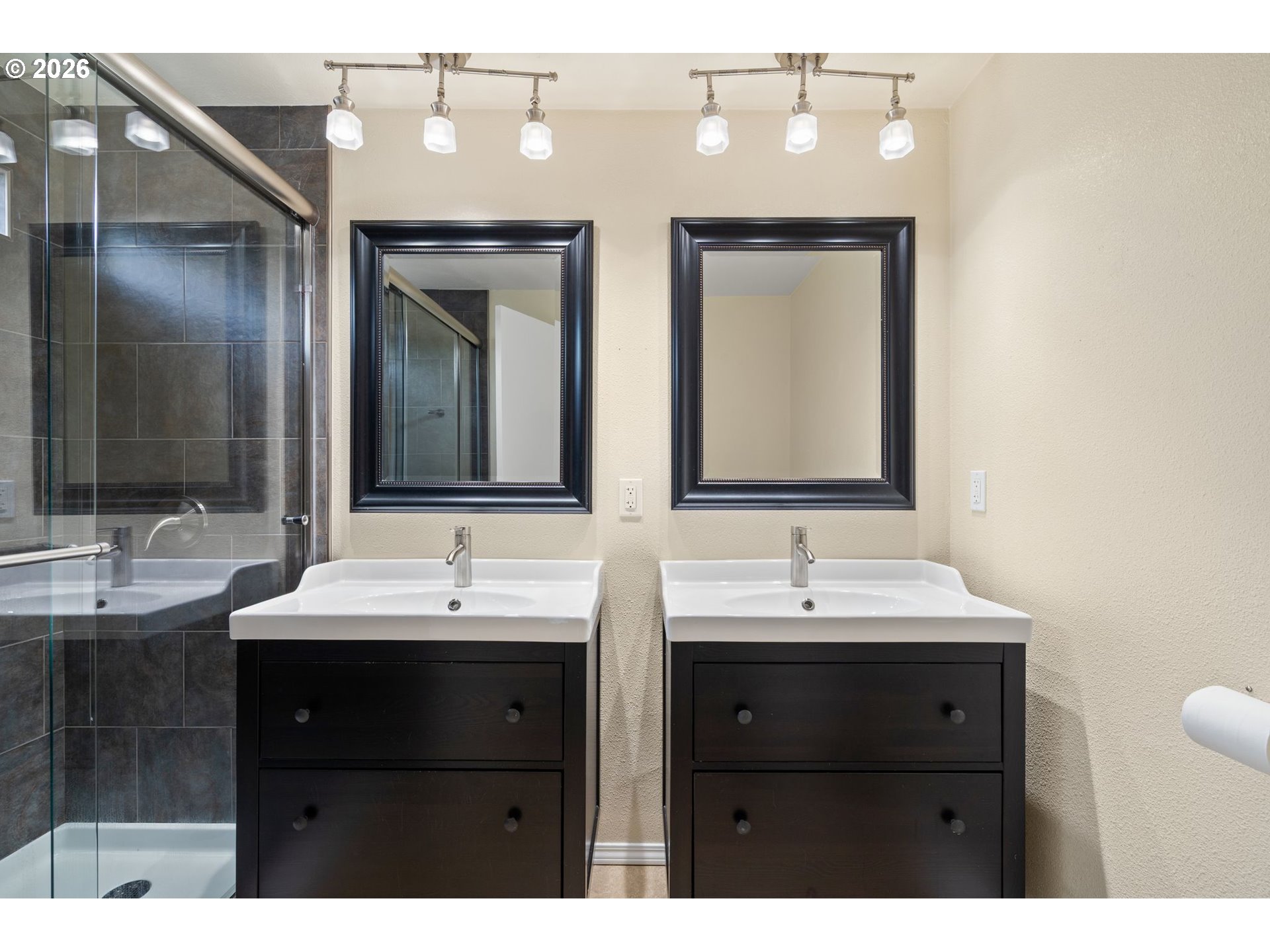 895 Southwest 166th Avenue Beaverton, OR 97006 - Photo 24 of 36 a bathroom with double vanity sinks and a mirror