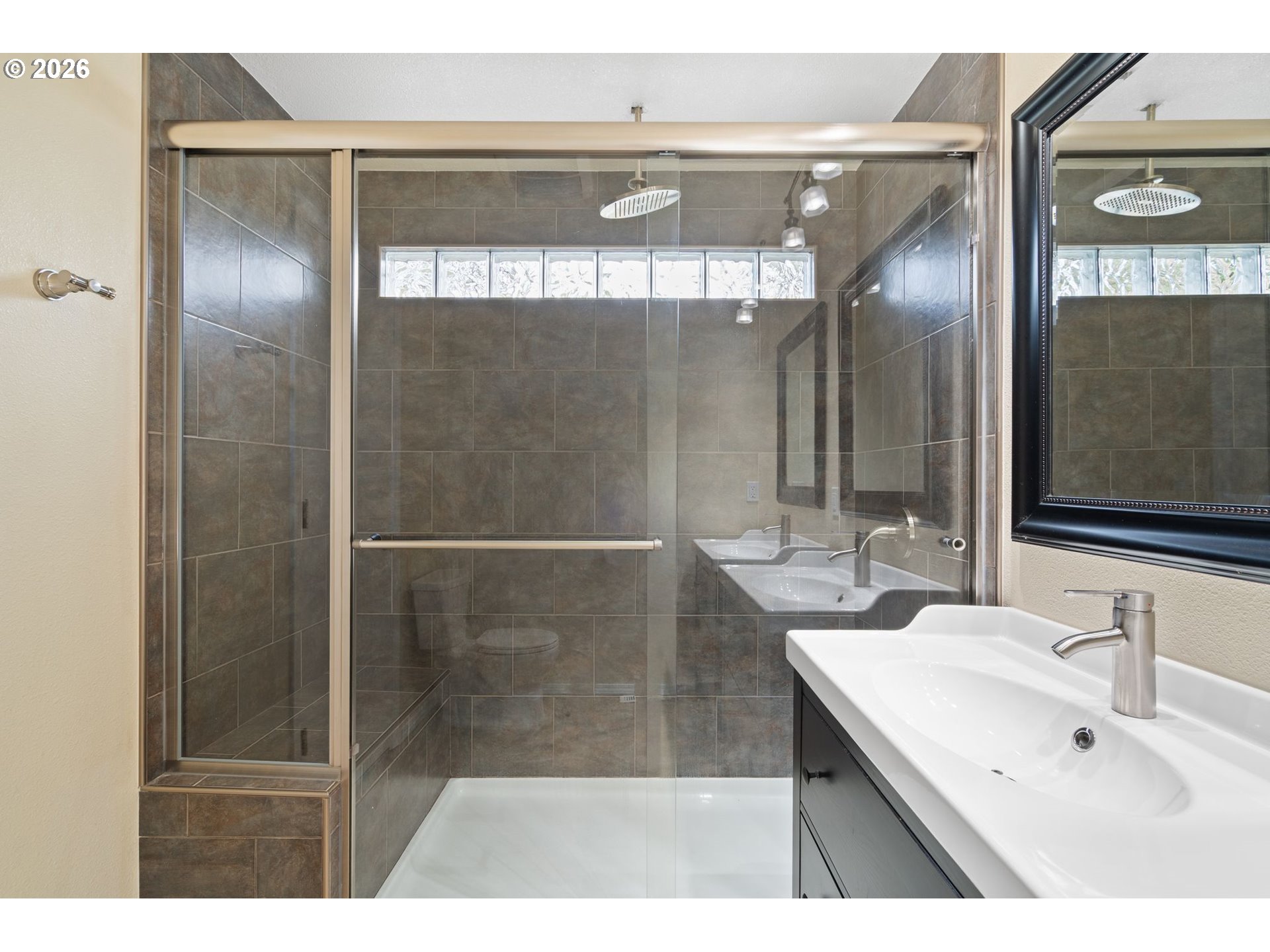 895 Southwest 166th Avenue Beaverton, OR 97006 - Photo 25 of 36 a bathroom with a sink and a mirror