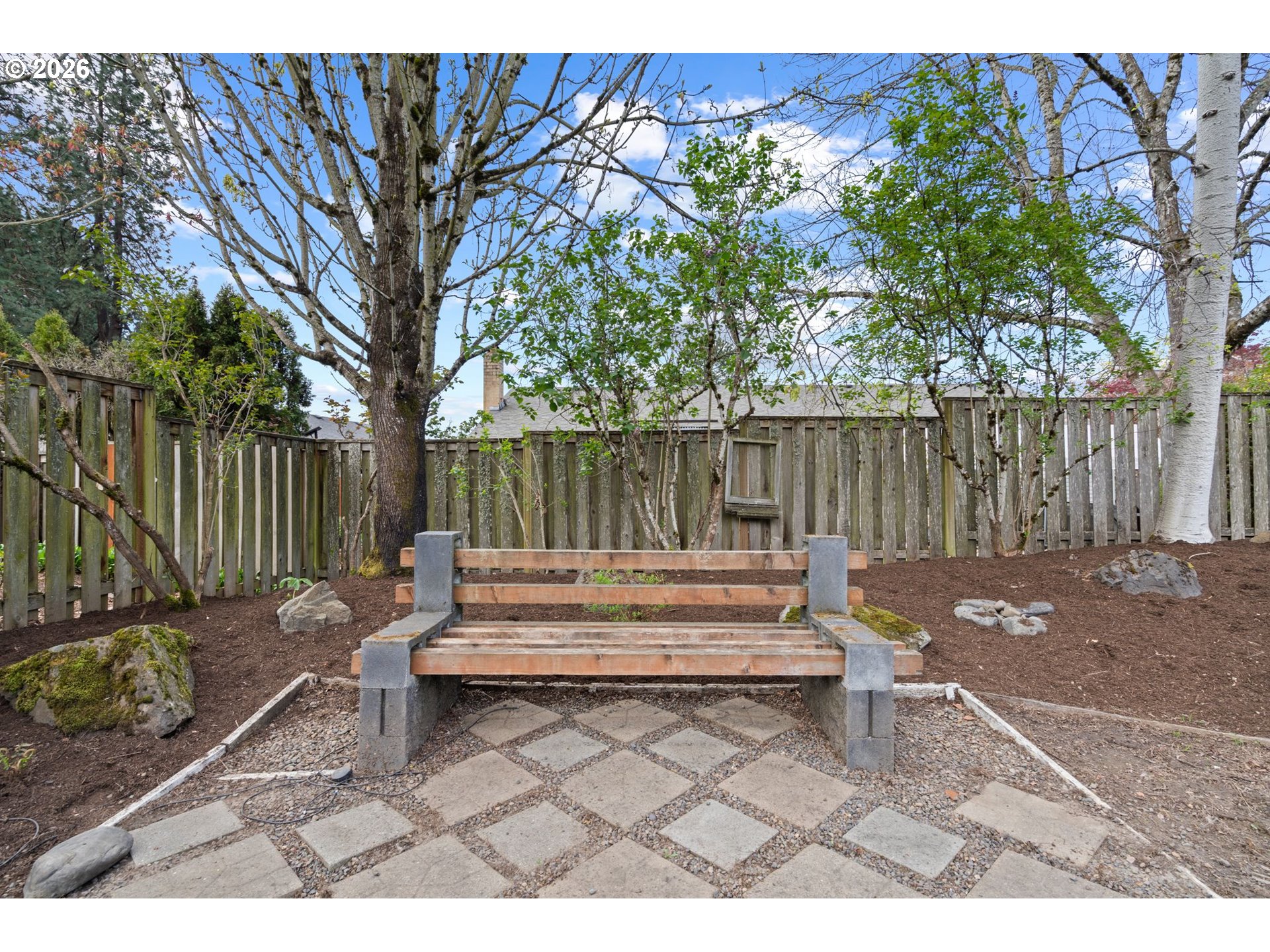 895 Southwest 166th Avenue Beaverton, OR 97006 - Photo 32 of 36 a backyard of a house with garden and outdoor seating