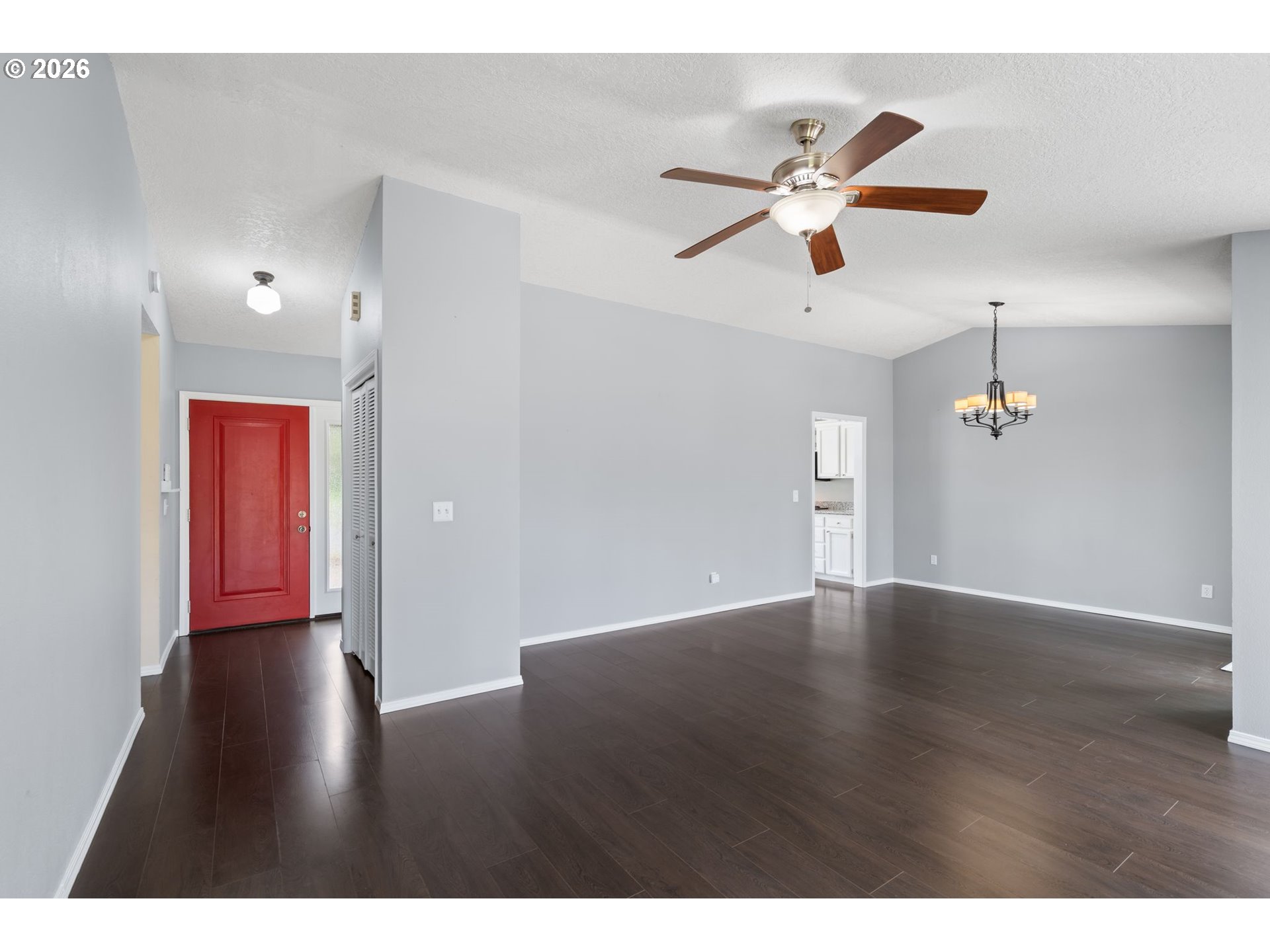 895 Southwest 166th Avenue Beaverton, OR 97006 - Photo 4 of 36 a view of an empty room with wooden floor