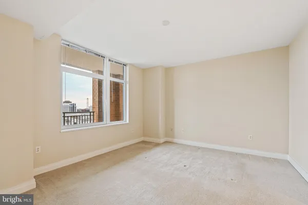 a view of an empty room with a window