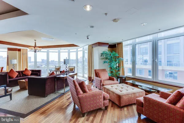 a room with pool table and windows