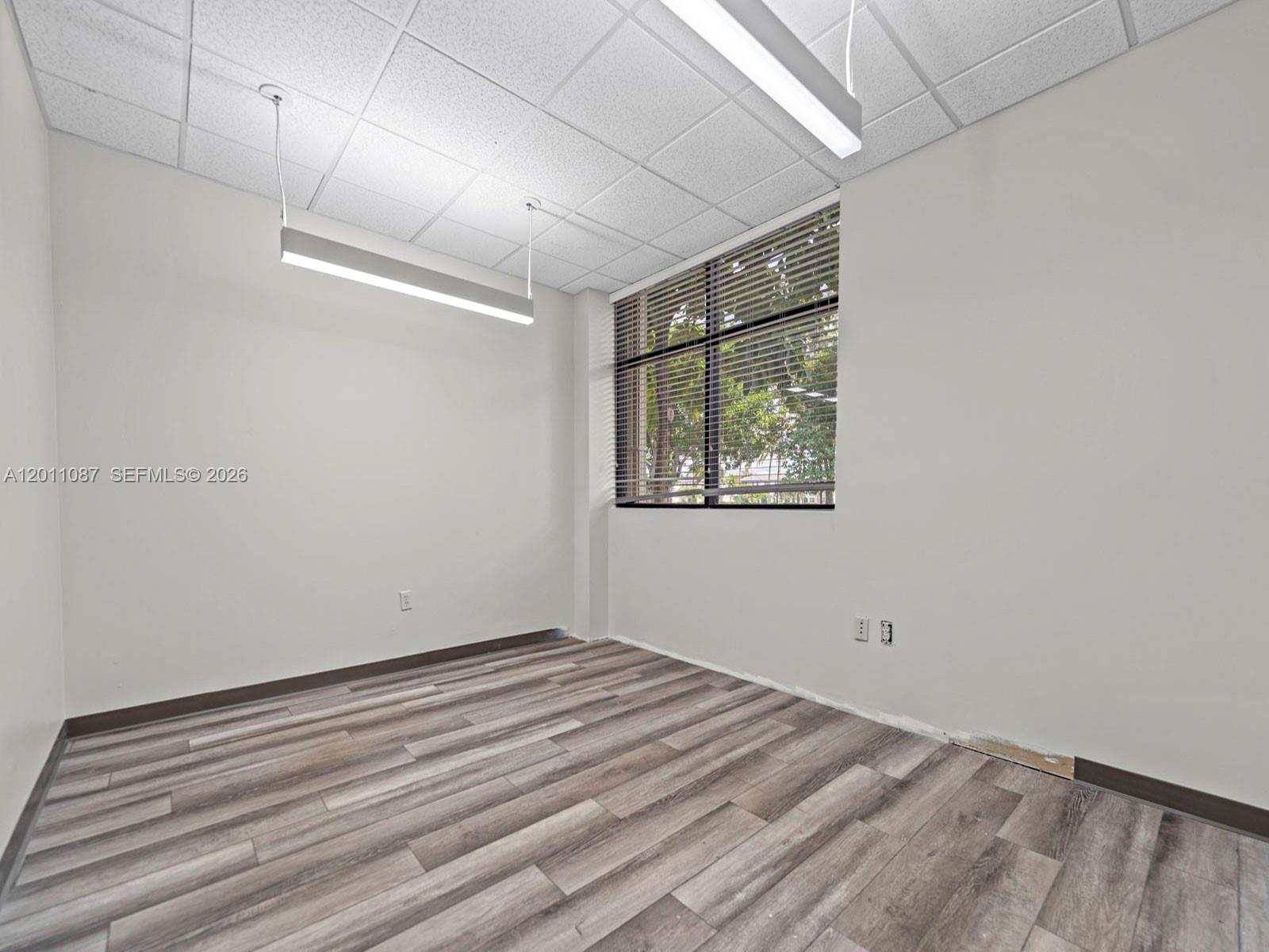 735 Shotgun Road Sunrise, FL 33326 - Photo 8 of 21 a view of room with window and ceiling fan