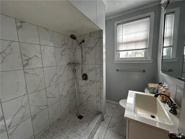 a bathroom with a sink and window