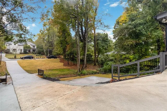 a view of backyard with swimming pool