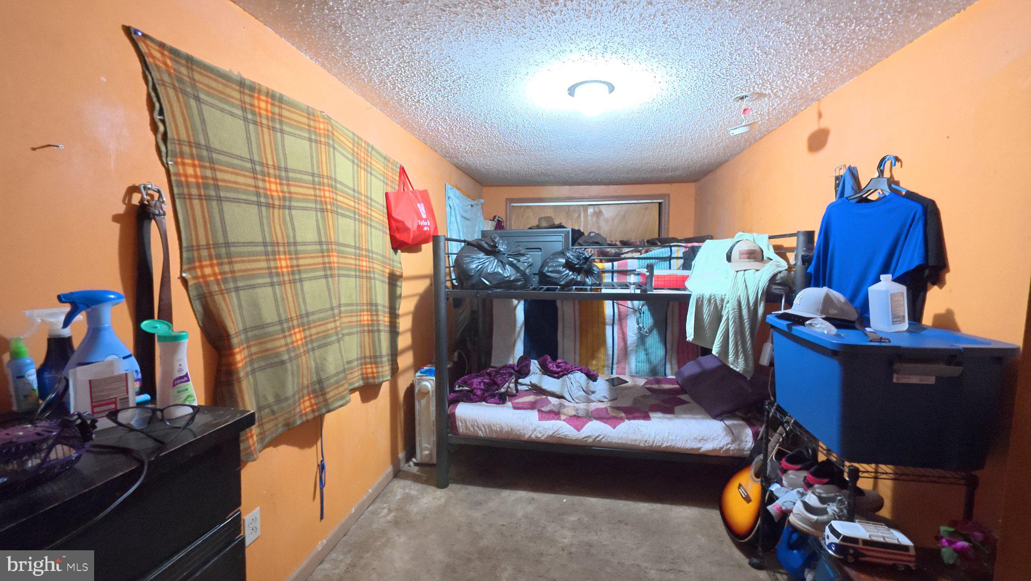 458 North Burlington Road Bridgeton, NJ 08302 - Photo 5 of 9 Cozy room with vibrant orange walls.